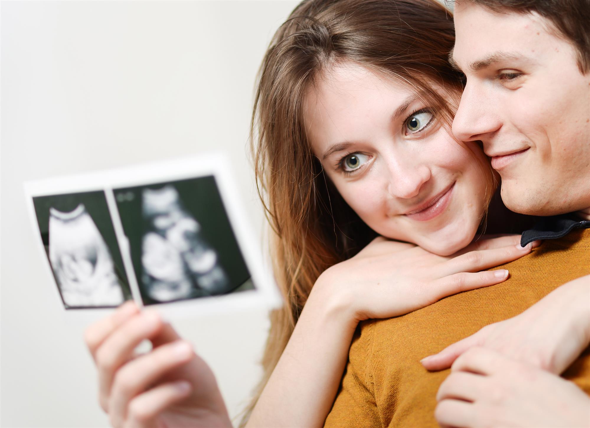 couple looks at ultrasound