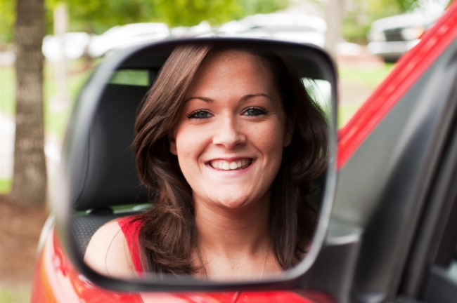 woman smiling while driving