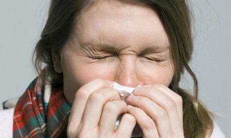 woman blowing nose