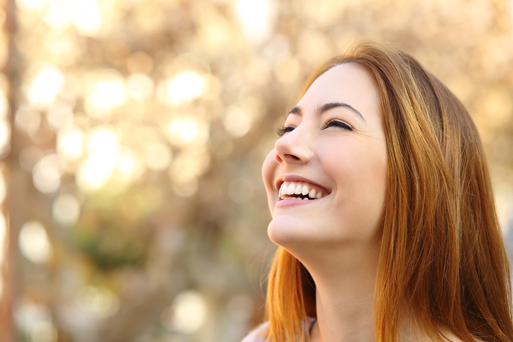 smiling redhead looking up