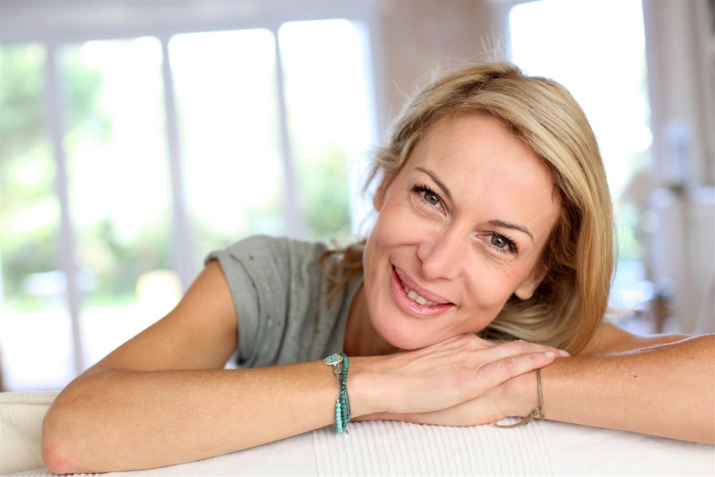 smiling woman with crossed arms