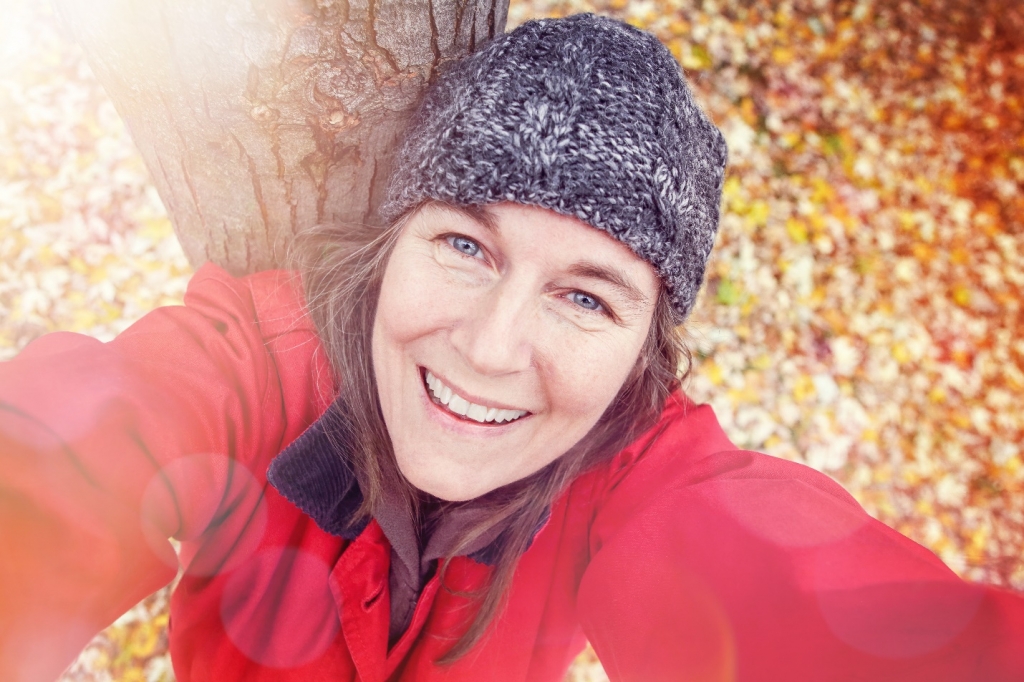 Middle aged woman taking a selfie