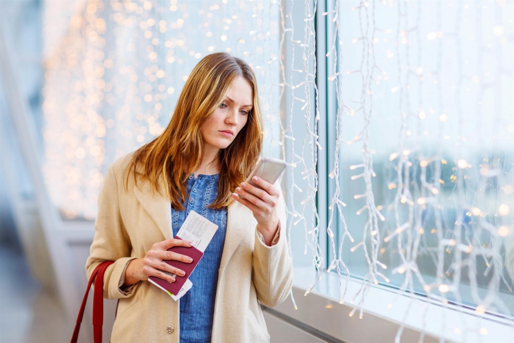 Woman Holding Boarding Pass