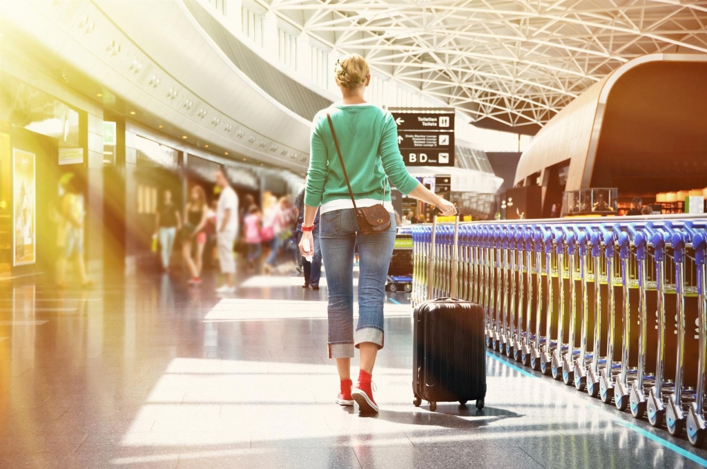 woman walking through airport