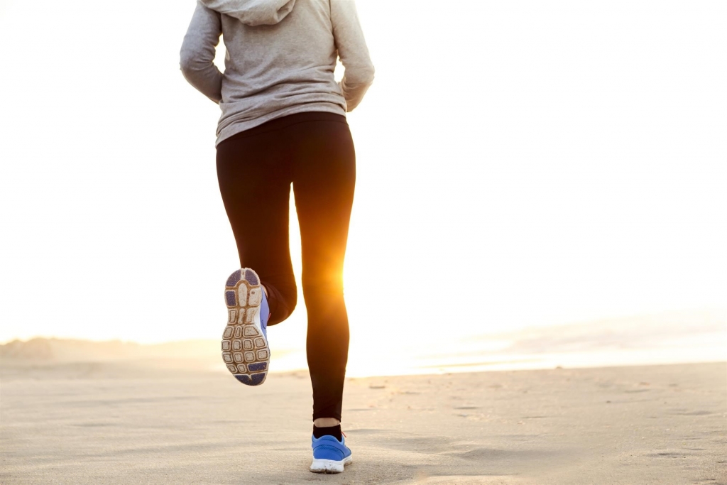 woman running on the beach